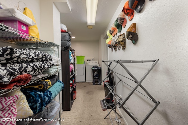 storage area featuring washing machine and dryer