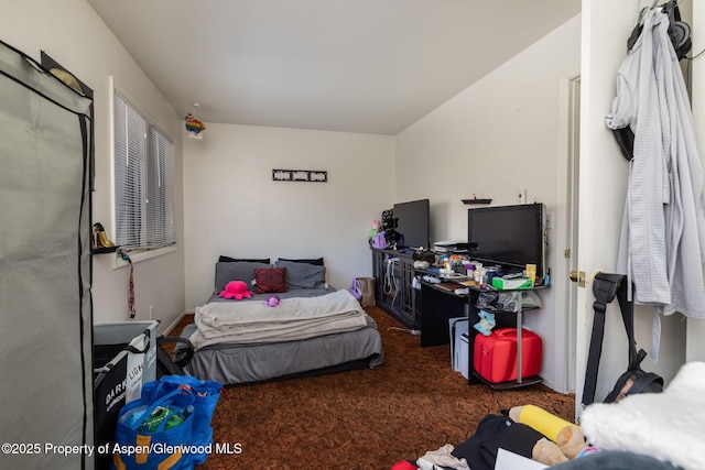 bedroom with dark colored carpet