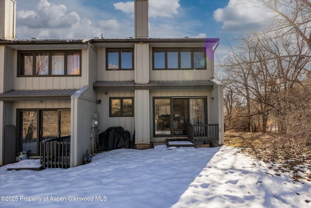 view of snow covered house