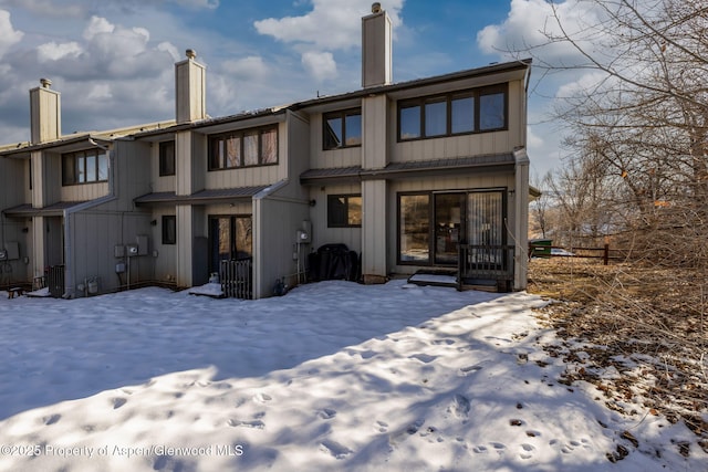 view of snow covered house