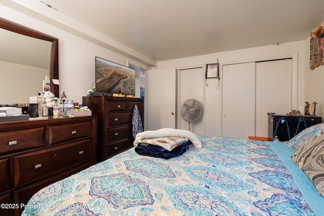 bedroom featuring two closets