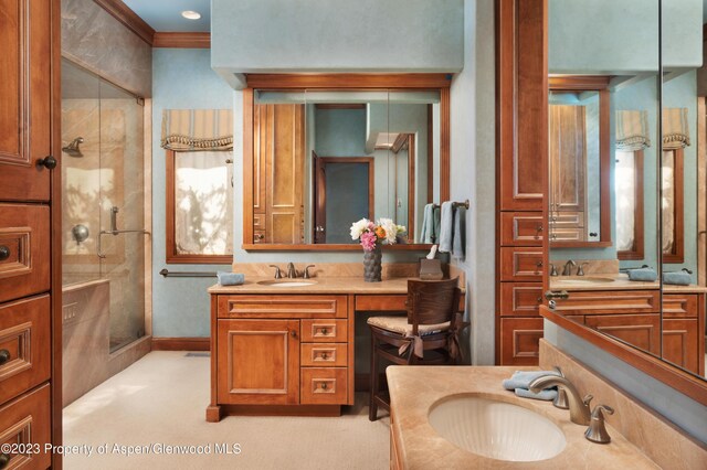 bathroom with vanity, walk in shower, and ornamental molding