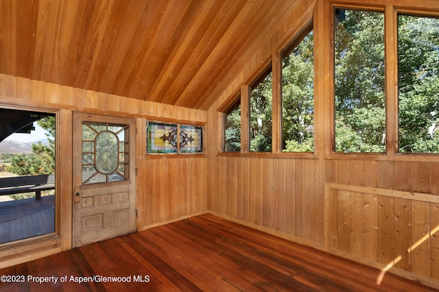 unfurnished sunroom featuring a healthy amount of sunlight and lofted ceiling