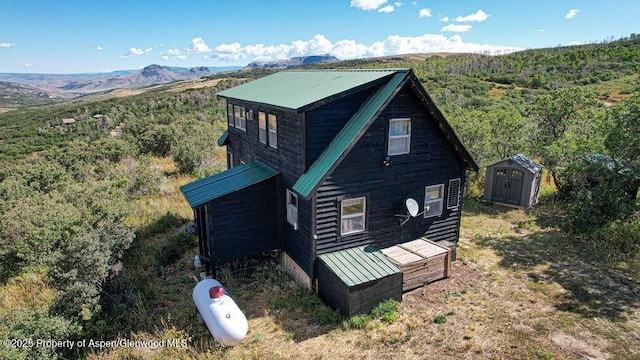 3547 Timberlane Dr Lot 586, Craig, CO 81625 - view of home's exterior featuring metal roof and a mountain view