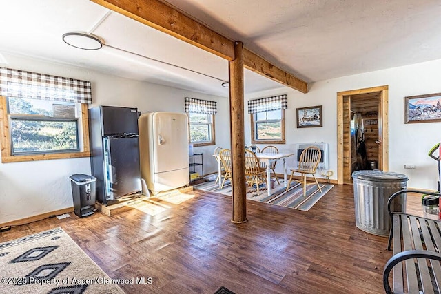 3547 Timberlane Dr Lot 586, Craig, CO 81625 - kitchen with freestanding refrigerator, wood finished floors, beam ceiling, baseboards, and heating unit