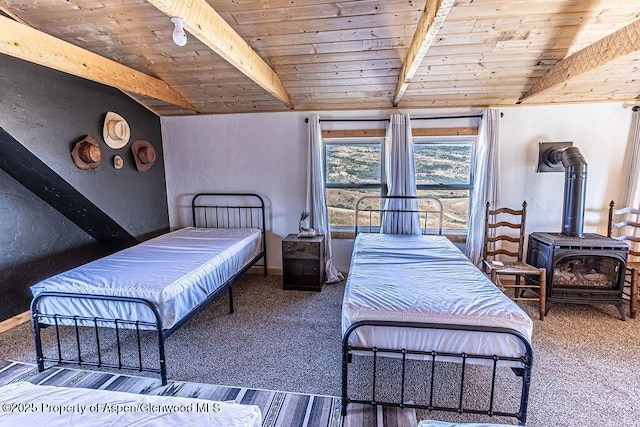 3547 Timberlane Dr Lot 586, Craig, CO 81625 - carpeted bedroom with wood ceiling with exposed beams and a wood stove