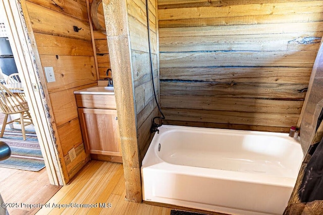 3547 Timberlane Dr Lot 586, Craig, CO 81625 - full bath with wooden walls, wood finished floors, vanity, and bathing tub / shower combination
