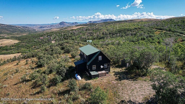 3547 Timberlane Dr Lot 586, Craig, CO 81625 - view of subject property with a mountain backdrop and a heavily wooded area