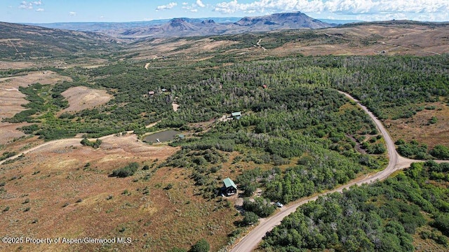 3547 Timberlane Dr Lot 586, Craig, CO 81625 - view of property location with a mountainous background and a heavily wooded area