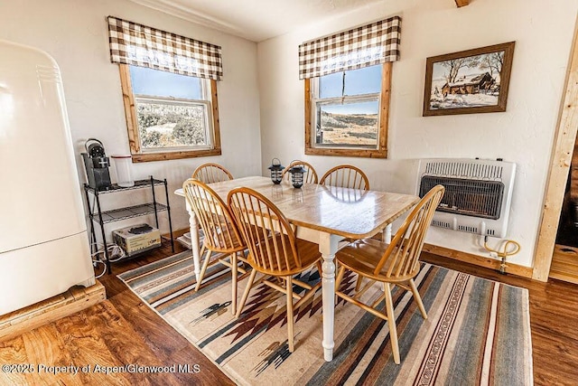 3547 Timberlane Dr Lot 586, Craig, CO 81625 - dining area with heating unit, wood finished floors, healthy amount of natural light, and baseboards