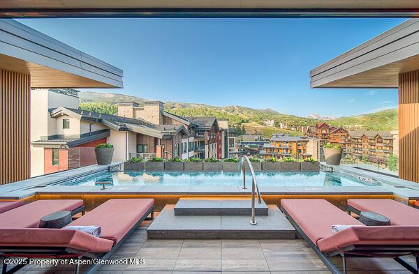 view of pool featuring a mountain view