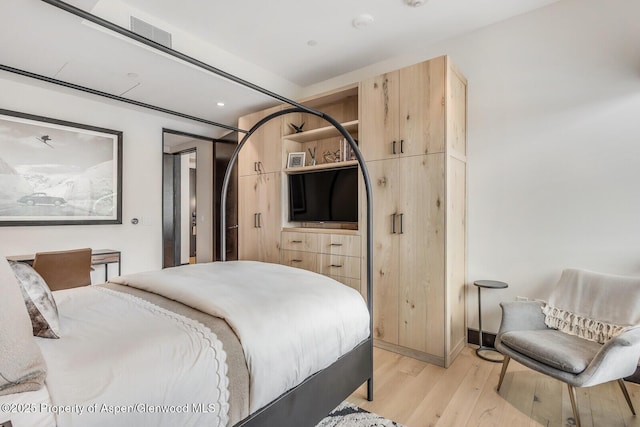 bedroom with light hardwood / wood-style flooring