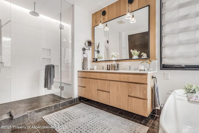 bathroom featuring vanity and plus walk in shower