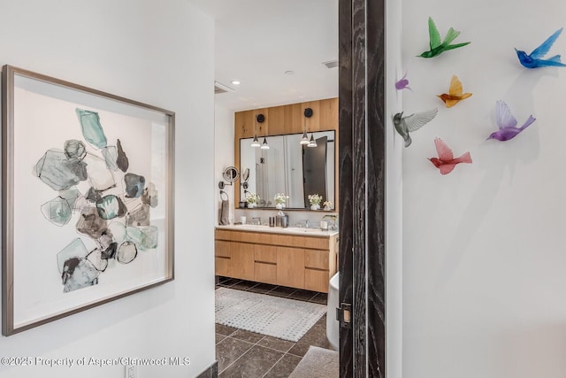 bathroom featuring tile patterned floors and vanity