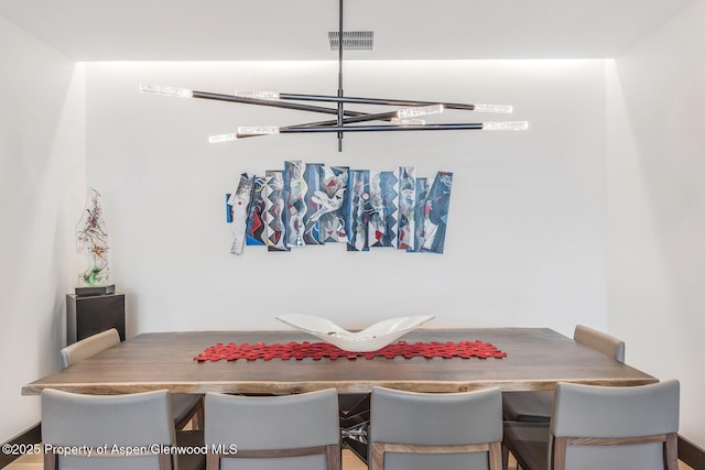 dining area with a chandelier