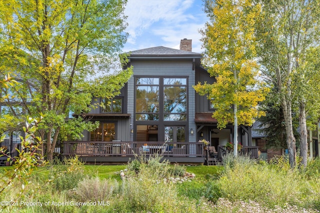 rear view of property with a deck