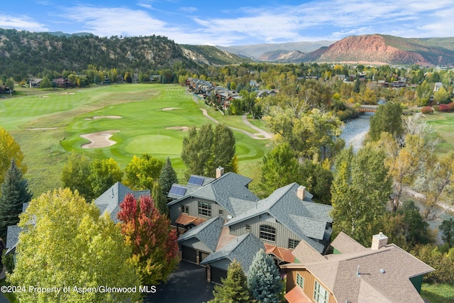 birds eye view of property featuring a mountain view