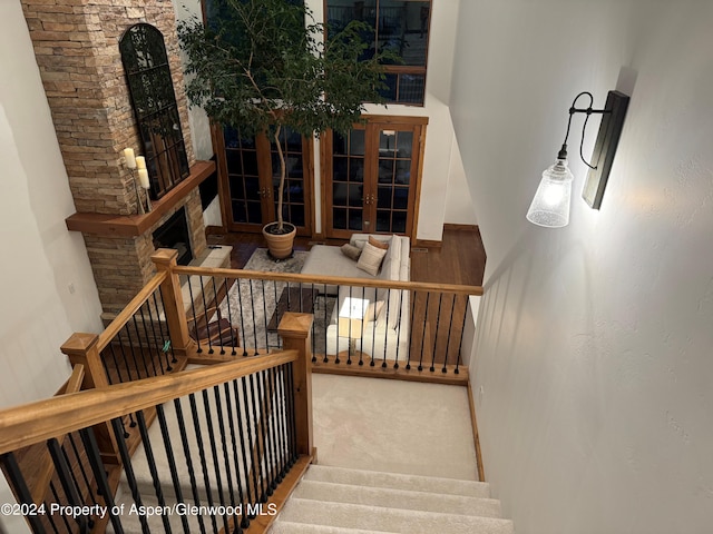 staircase with carpet and french doors