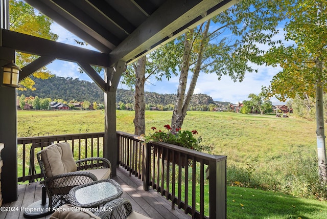 deck featuring a lawn