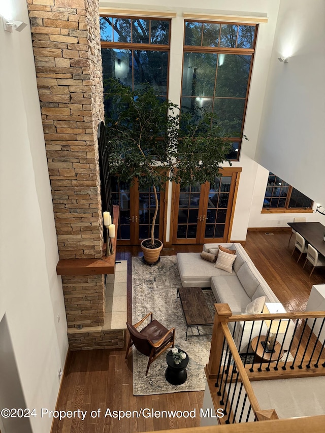 living room with french doors and hardwood / wood-style flooring