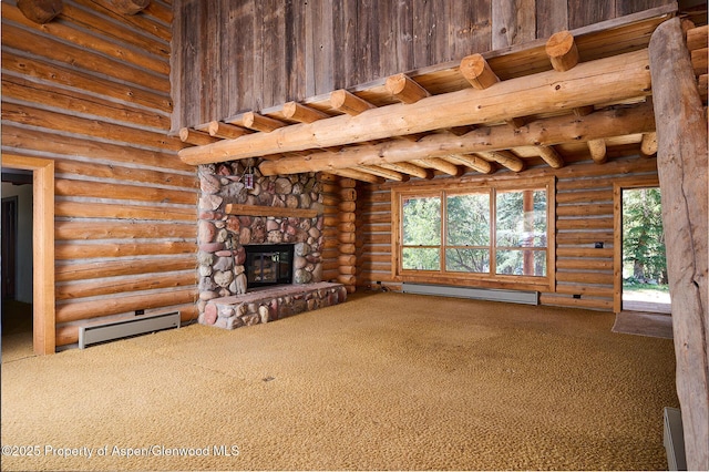 63 Alexander Ave, Snowmass, CO 81654 - unfurnished living room with a baseboard heating unit, baseboard heating, carpet floors, a stone fireplace, and healthy amount of natural light