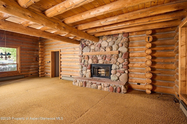 63 Alexander Ave, Snowmass, CO 81654 - unfurnished living room featuring a wooden ceiling with exposed beams, carpet floors, a fireplace, and a baseboard radiator