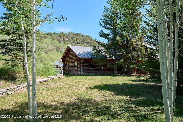63 Alexander Ave, Snowmass, CO 81654 - view of grassy yard featuring a forest view