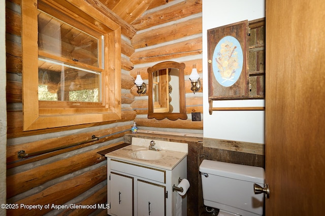 63 Alexander Ave, Snowmass, CO 81654 - bathroom featuring rustic walls and vanity