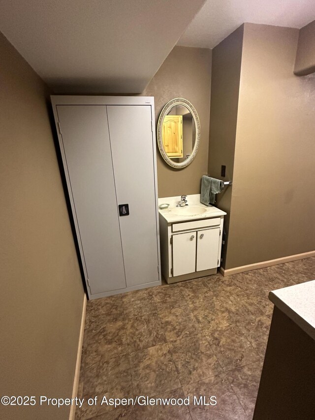 595 Colorado St, Craig, CO 81625 - bathroom featuring vanity and baseboards