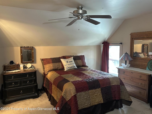595 Colorado St, Craig, CO 81625 - bedroom with light colored carpet, vaulted ceiling, and ceiling fan