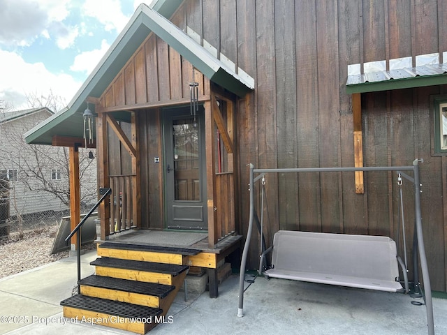 595 Colorado St, Craig, CO 81625 - doorway to property with board and batten siding and fence