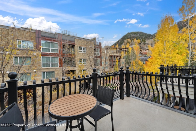 balcony featuring a mountain view