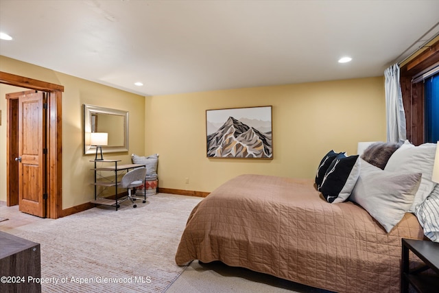 bedroom featuring light colored carpet