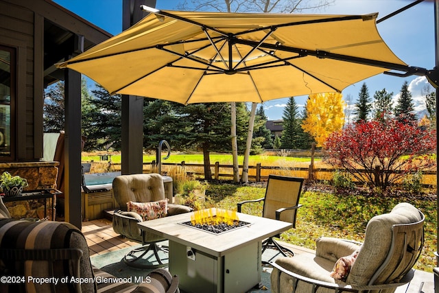 view of patio with a fire pit and a wooden deck