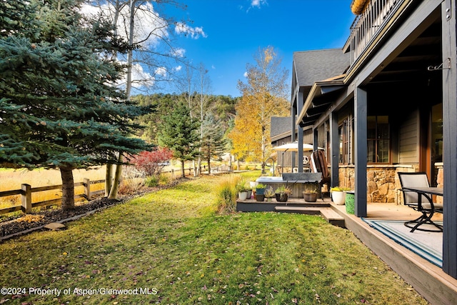 view of yard featuring a patio and a hot tub