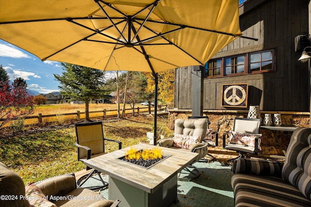 view of patio featuring an outdoor fire pit