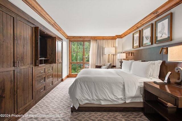 bedroom with carpet and crown molding