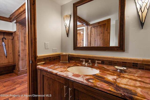 bathroom with hardwood / wood-style floors and vanity