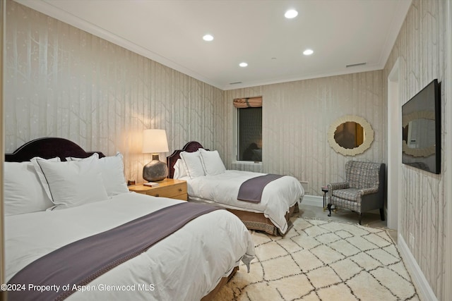 bedroom featuring crown molding