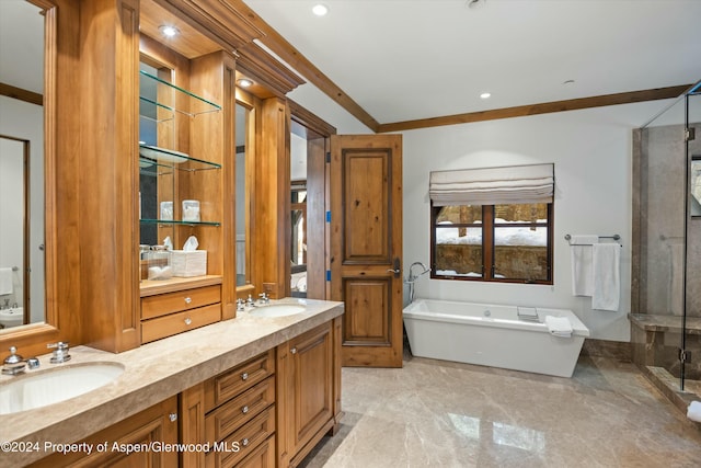 bathroom with vanity, ornamental molding, and shower with separate bathtub