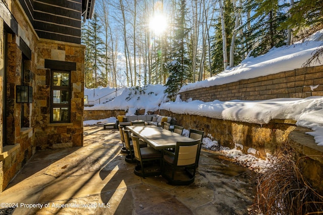 view of snow covered patio