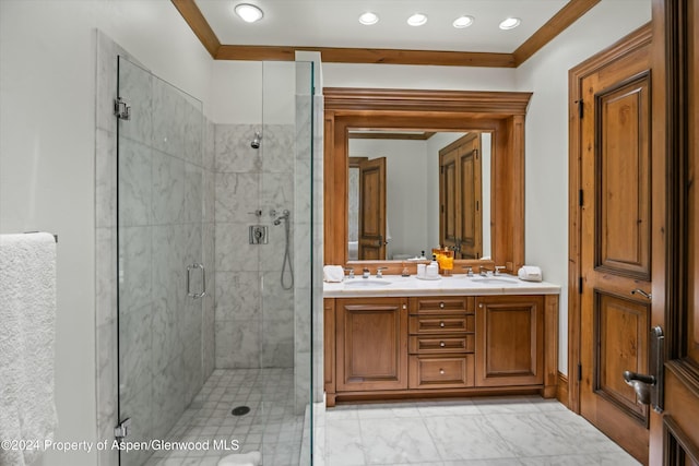 bathroom featuring vanity, a shower with door, and crown molding