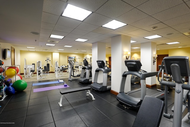 workout area featuring visible vents and a drop ceiling