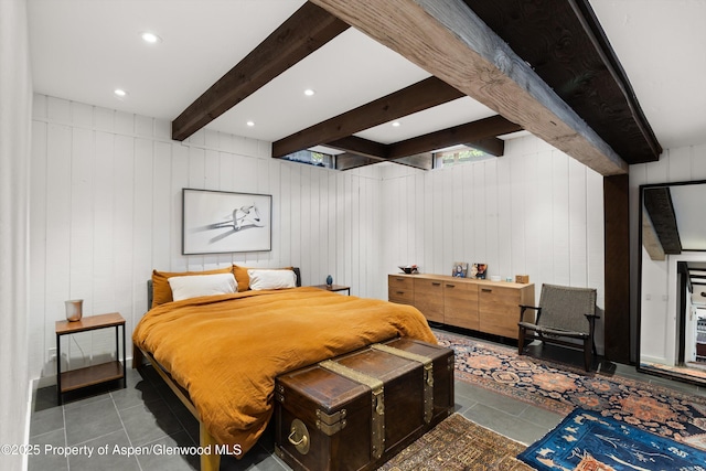 116 S Bill Creek Rd, Carbondale, CO 81623 - tiled bedroom featuring beamed ceiling, recessed lighting, and a decorative wall