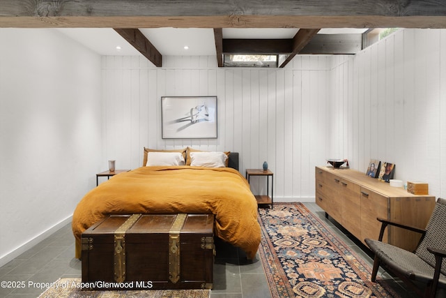 116 S Bill Creek Rd, Carbondale, CO 81623 - bedroom with beam ceiling, wood walls, and tile patterned flooring