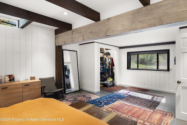 116 S Bill Creek Rd, Carbondale, CO 81623 - bedroom with beamed ceiling, wood walls, and a closet