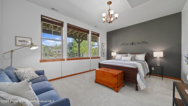 carpeted bedroom with a notable chandelier