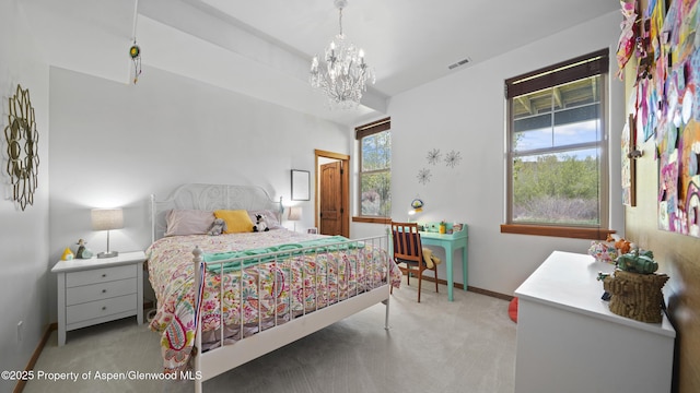 bedroom with light colored carpet and a notable chandelier