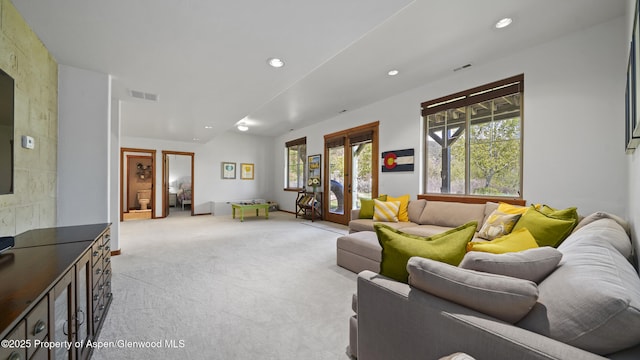 carpeted living room featuring french doors