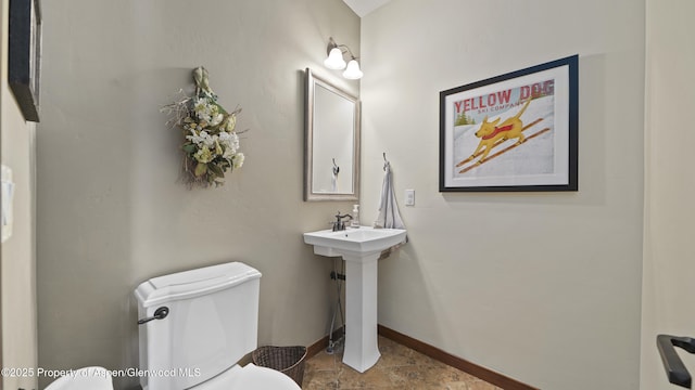 bathroom featuring toilet